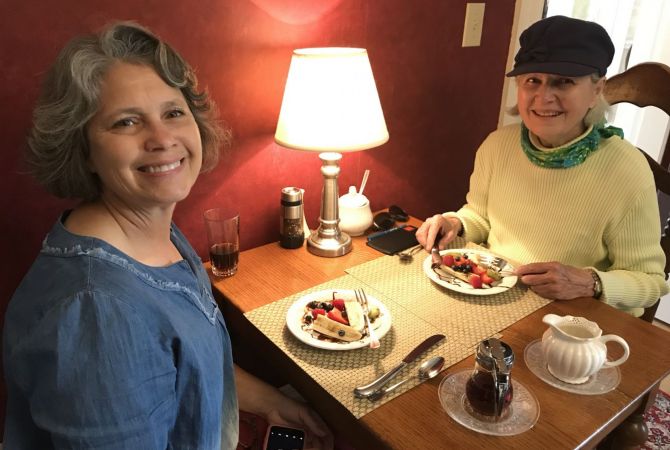Two guests enjoying breakfast at the inn