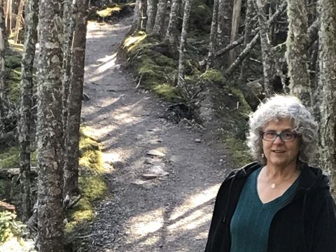 Innkeeper Mary Beth on hiking trail - photo by Jim Hoffman